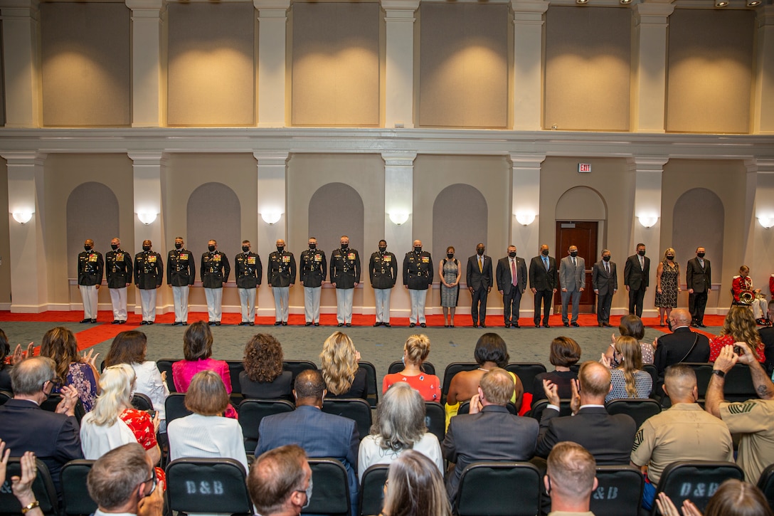Honorees stand at the position of attention for honors during the Brigadier General Select Orientation Course Honors Ceremony at Marine Barracks Washington, Aug. 16, 2021. The ceremony honors newly promoted and soon-to-be promoted brigadier generals along with senior executives. BGSOC is an annual, week-long course held in the National Capital Region to instruct the newly promoted individuals on their new rank and responsibilities. The hosting official for the evening was 38th Commandant of the Marine Corps, Gen. David H. Berger. (U.S. Marine Corps photo by Lance Cpl. Tanner D. Lambert)