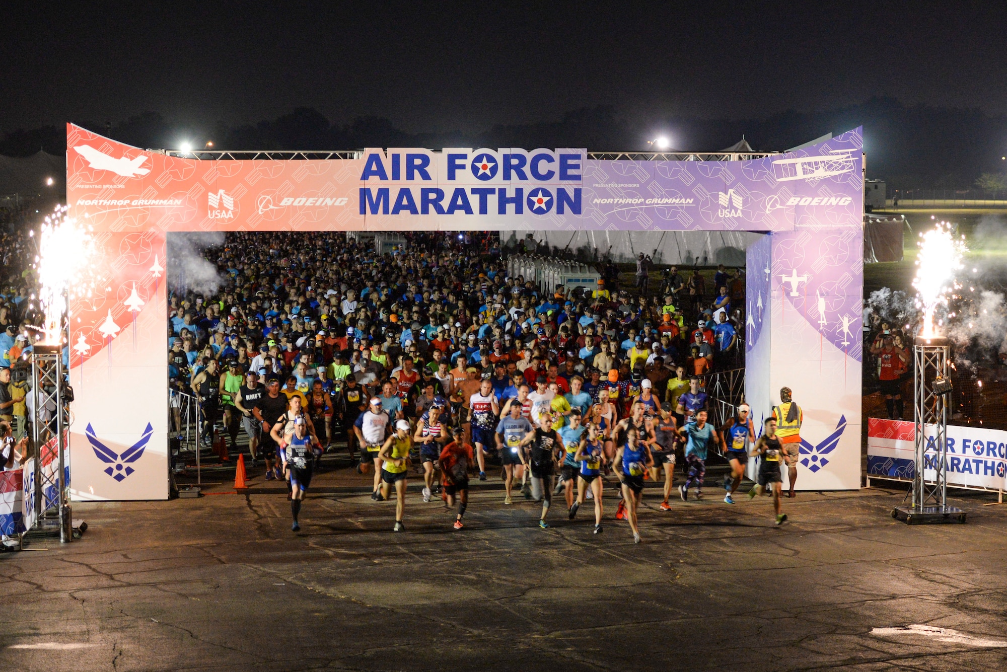 Runners take off at the start of the 2019 Air Force Marathon 10k run at Wright-Patterson Air Force Base, Ohio, Sept. 21, 2019. More than 12,700 runners and 2,600 volunteers from all 50 states and 15 different countries came out to run in the races 23rd year. (U.S. Air Force photo by Wesley Farnsworth)