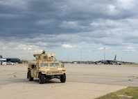 Airman with the 5th Security Forces Squadron helps ensure flightline security during Exercise Prairie Vigilance on Aug. 11, 2021 at Minot Air Force Base, N.D. Prairie Vigilance tests the 5th Bomb Wing’s ability to conduct strategic-bomber readiness operations. (U.S. Air Force photo by Airman 1st Class Evan Lichtenhan)