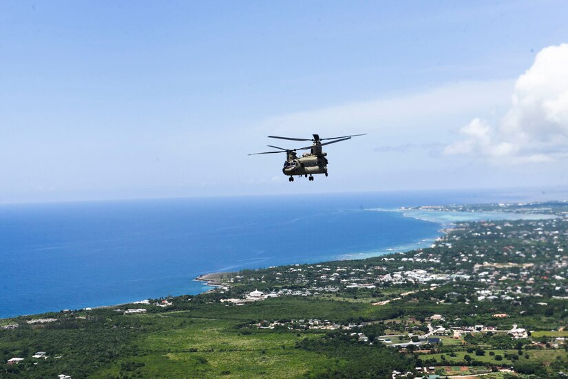 A U.S. Army CH-47 Chinook helicopter assigned to the 1st Battalion, 228th Aviation Regiment, Joint Task Force-Bravo flies off the coast Montego Bay, Jamaica, August 16. Two U.S. Army CH-47 Chinook and two UH-60 Black Hawk helicopters with the 1-228 deployed from Soto Cano Air Base, Honduras to support U.S. Southern Command operations to assist Haiti after a 7.2 earthquake devastated the country. (U.S. Air Force photo by Capt. Annabel Monroe)