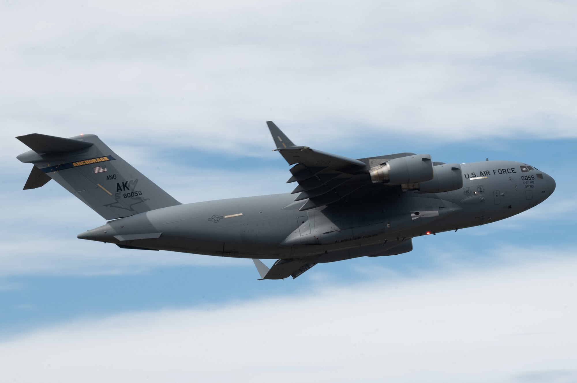 A C-17 Globemaster III assigned to the Pacific Air Forces demonstration team at Joint Base Pearl Harbor-Hickam, Hawaii takes off during the 2021 Arctic Lightning Airshow on Eielson Air Force Base, Alaska, July 30, 2021.