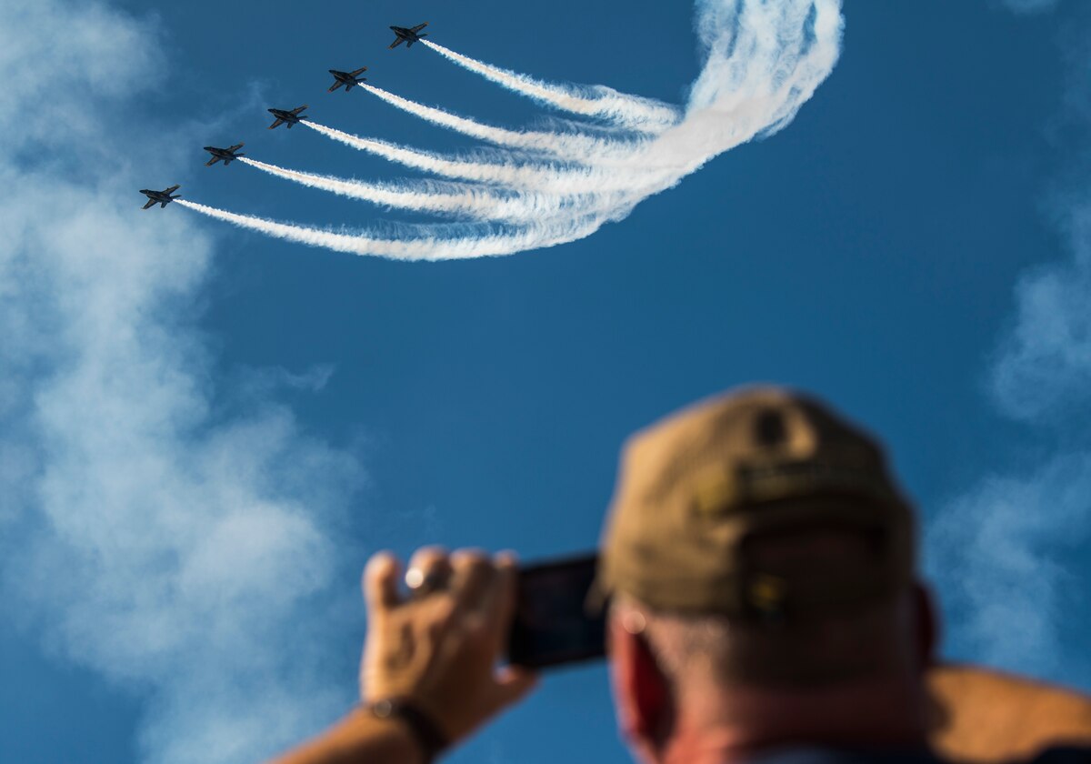 A 2021 Arctic Lightning Airshow attendee captures The U.S. Navy Air Demonstration Squadron, the Blue Angels, on his personnel device on Eielson Air Force Base, Alaska, Aug. 1, 2021.