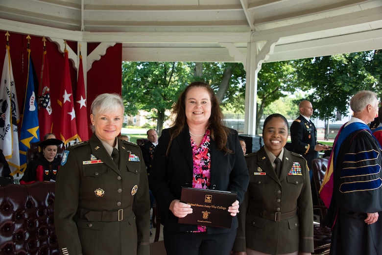 Amy Bednar (center), a research mathematician at the U.S. Army Engineer Research and Development Center’s Information Technology Laboratory, graduated from the Army War College in Carlisle Barracks, Pennsylvania, July 23, 2021,. Bednar was part of a two-year distance education class, which included 391 students from military, federal agencies and other countries around the world.