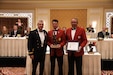 Maj. Gen. (Ret.) Jeff Burton (center), the previous adjutant general of the Utah National Guard, receives the Bronze Minuteman award from Maj. Gen. Michael Turley (left), adjutant general of the Utah National Guard, and Maj. Gen. (Ret.) Brian Tarbet (right), commander Honorary Colonels Corps, Aug. 12, 2021, at the Little America Hotel in Salt Lake City, Utah. The Bronze Minuteman Award recognizes community leaders for their extraordinary support and leadership to the citizens of Utah. (U.S. Army photo by Sgt. 1st Class John Etheridge)