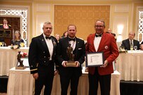 Mr. Joe Rupp, a retired United States Marine Corps lieutenant colonel, and board member of the Young Lawyer Division of the Utah State Bar, receives the Bronze Minuteman award
