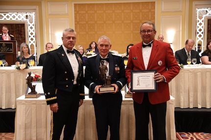 Brig. Gen. (Ret.) Larry Lunt, member of the Utah Air National Guard for 36 years, and former member of the Utah House of Representatives, receives the Bronze Minuteman award