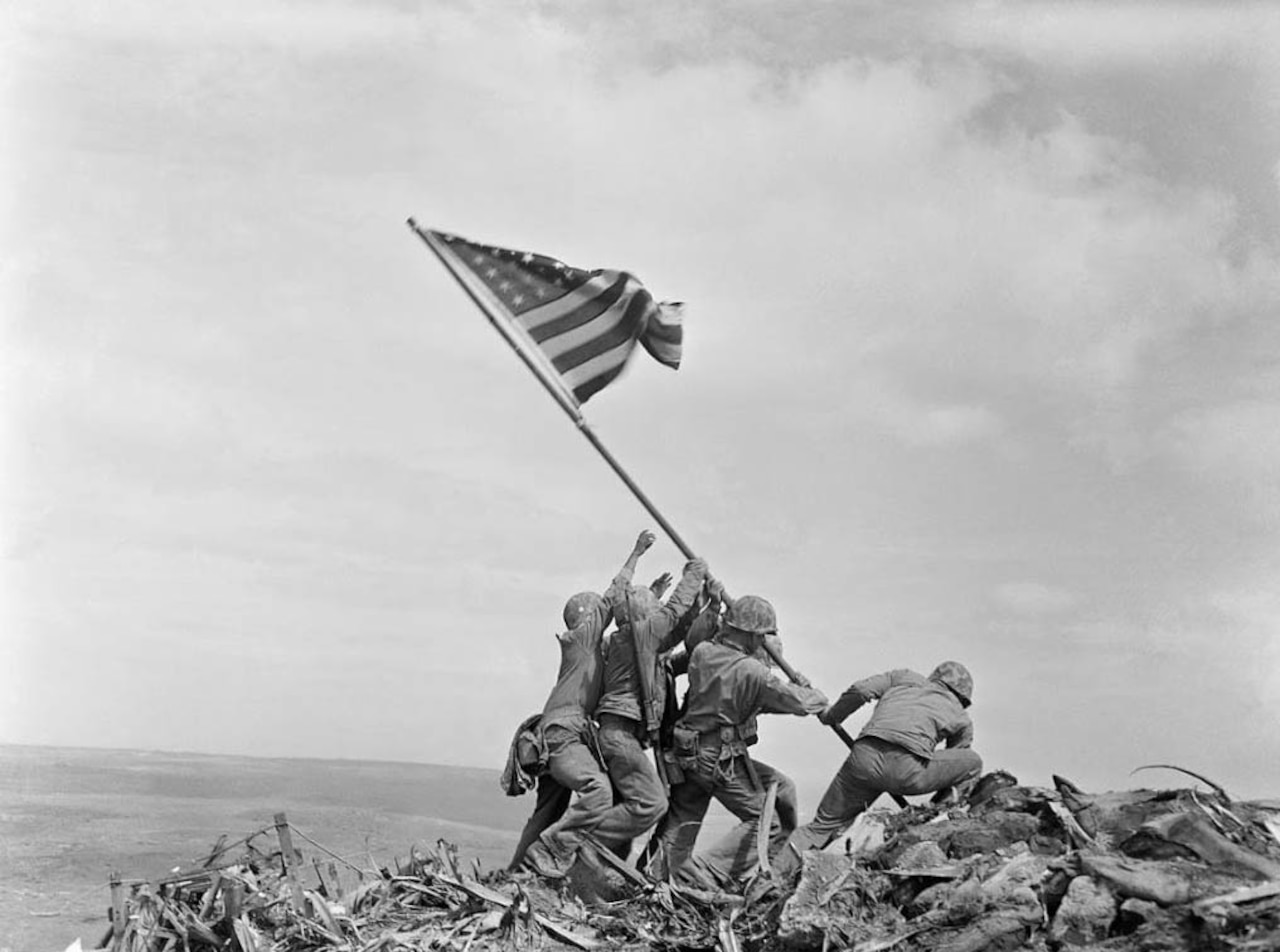 Marines raise a U.S. flag