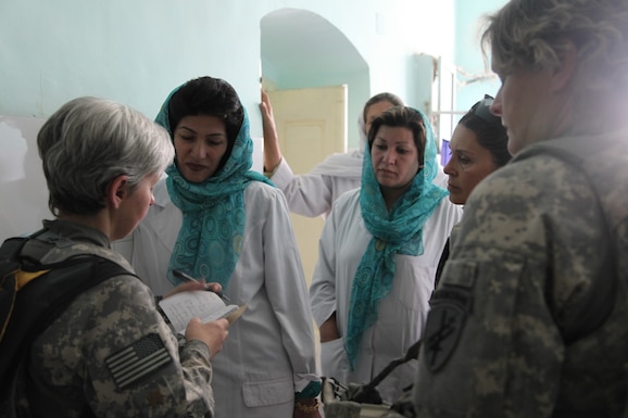 U.S. Army Maj. Lora Bowens, a nurse practitioner with 86th Infantry Brigade Combat Team (Mountain), 86th IBCT (MTN) Task Force Wolverine and a Saint Albans, W.Va., resident, writes down a list of medical supplies that are needed by the Women's Birthing Center, Charikar, Parwan province, Afghanistan, Sept. 15, 2010. Bowens is a member of the Female Engagement Team (FET) who visits the Women's Birthing Center to address some concerns the women may have within the center. (U.S. Army photo by Spc. Kristina Gupton/Released)