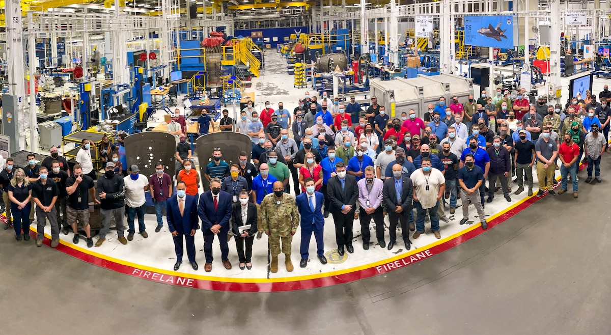 Air Force Chief of Staff Gen. CQ Brown, Jr., poses for a group photo following a discussion about F135 engine production at Tinker Air Force Base, Okla., Aug. 10, 2021.