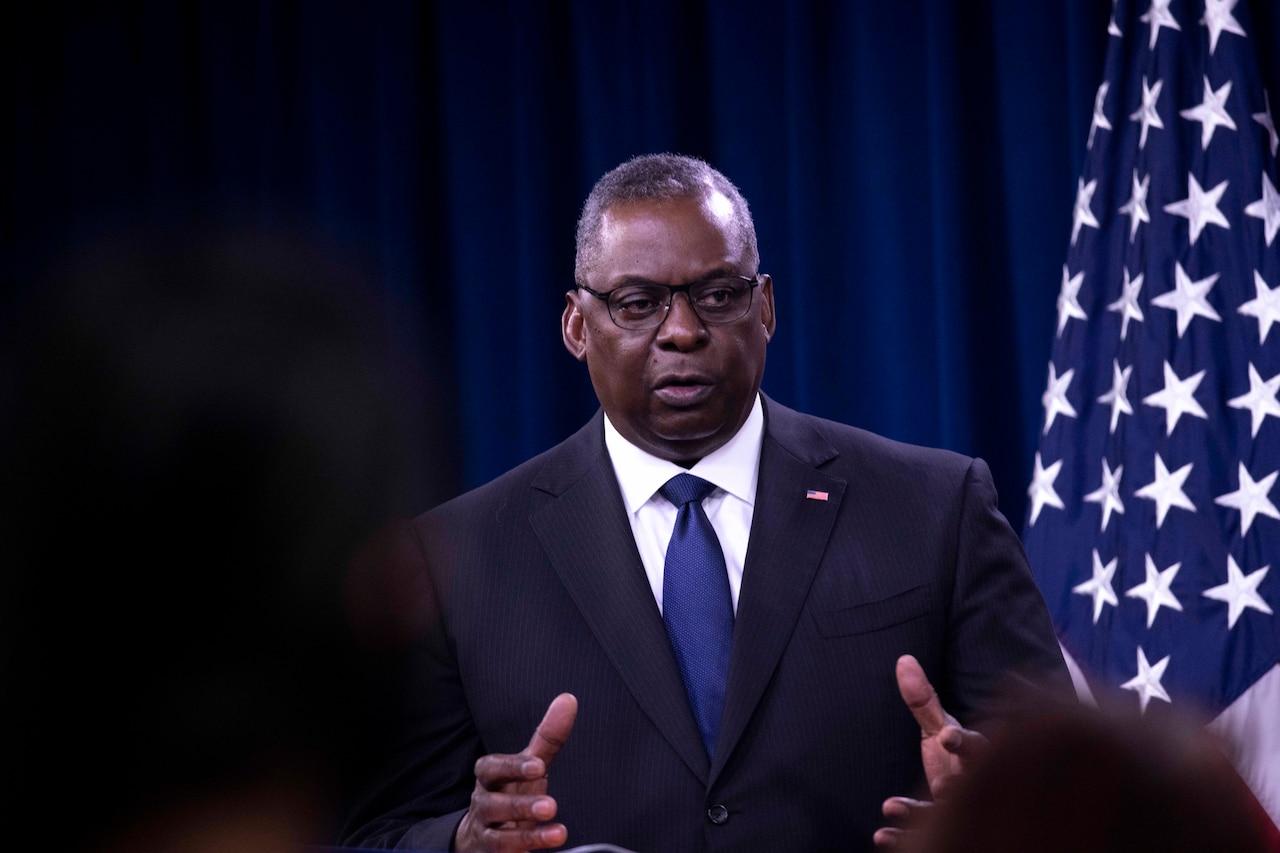 Secretary of Defense Lloyd J. Austin III speaks at a podium.