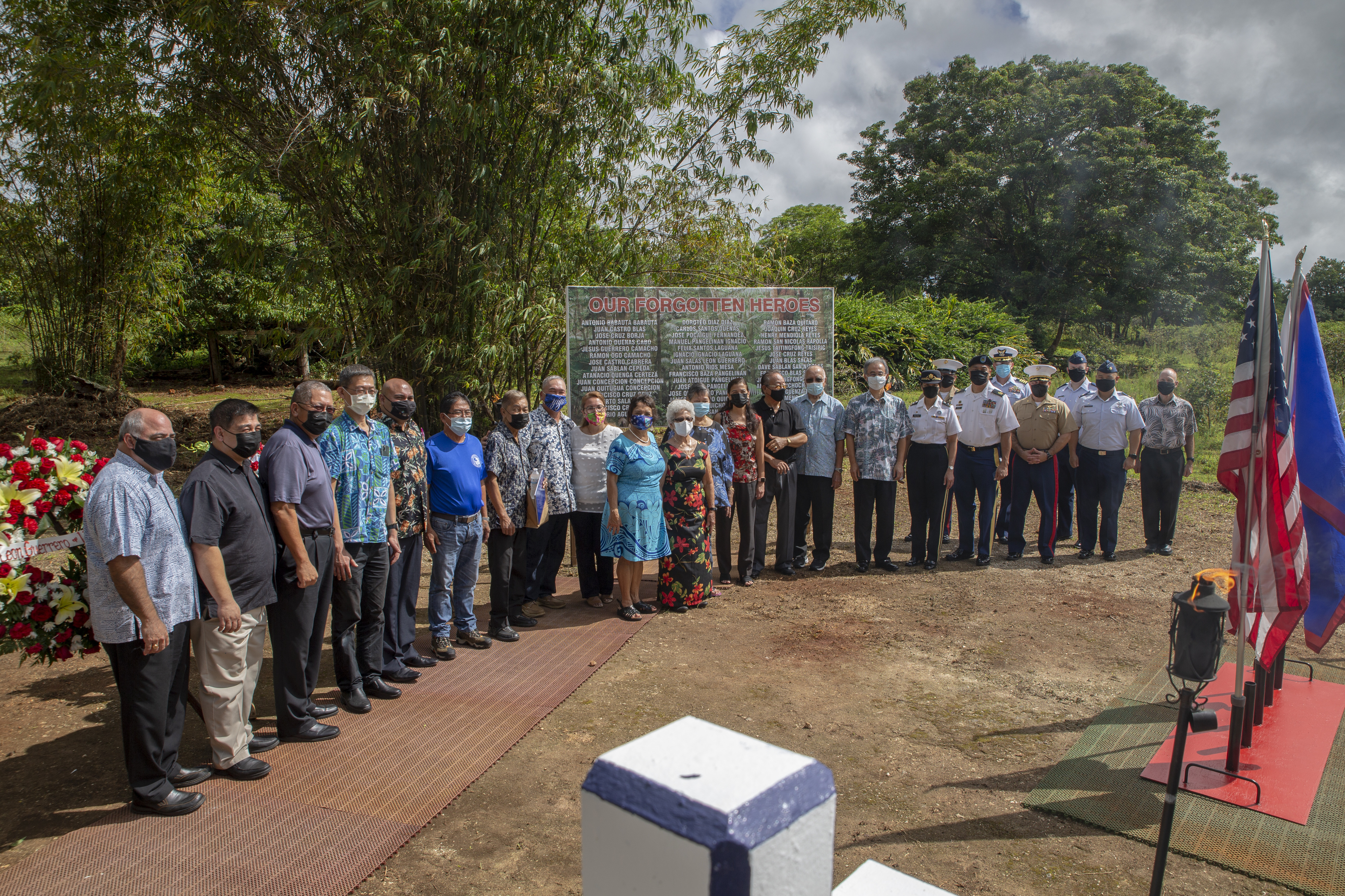 Senior leaders pose for a group photograph with Government of Guam officials and World War II survivors during a wreath laying ceremony and memorial service at the Chagui’an Memorial in Yigo, Guam, Aug. 7, 2021.