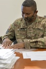 Sgt. Carlos Herrera, 336th Financial Management Support Center financial management specialist, prepares morning injects for Diamond Saber at Fort McCoy, Wisconsin, Aug. 14, 2021. Diamond Saber is a U.S. Army Reserve-led exercise that incorporates participation from all components and joint services, and it prepares finance and comptroller Soldiers on the warfighting functions of funding the force, payment support, disbursing operations, accounting, fiscal stewardship, auditability and data analytics. (U.S. Army photo by Mark R. W. Orders-Woempner)