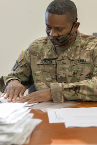 Sgt. Carlos Herrera, 336th Financial Management Support Center financial management specialist, prepares morning injects for Diamond Saber at Fort McCoy, Wisconsin, Aug. 14, 2021. Diamond Saber is a U.S. Army Reserve-led exercise that incorporates participation from all components and joint services, and it prepares finance and comptroller Soldiers on the warfighting functions of funding the force, payment support, disbursing operations, accounting, fiscal stewardship, auditability and data analytics. (U.S. Army photo by Mark R. W. Orders-Woempner)