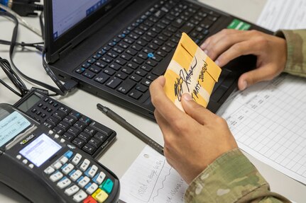 Spc. Domingo Perez-Lopez, 395th Financial Management Support Unit financial management specialist, logs in simulated captured currency using a financial management tactical platform, or FMTP, during Diamond Saber at Fort McCoy, Wisconsin, Aug. 14, 2021. Diamond Saber is a U.S. Army Reserve-led exercise that incorporates participation from all components and joint services, and it prepares finance and comptroller Soldiers on the warfighting functions of funding the force, payment support, disbursing operations, accounting, fiscal stewardship, auditability and data analytics. (U.S. Army photo by Mark R. W. Orders-Woempner)