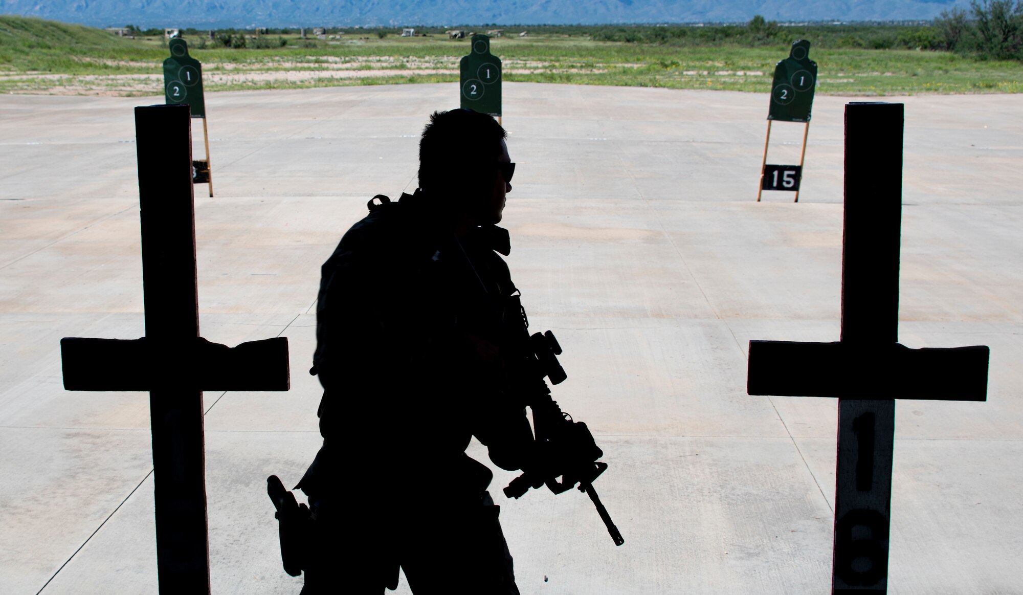 A photo of an airman holding a rifle
