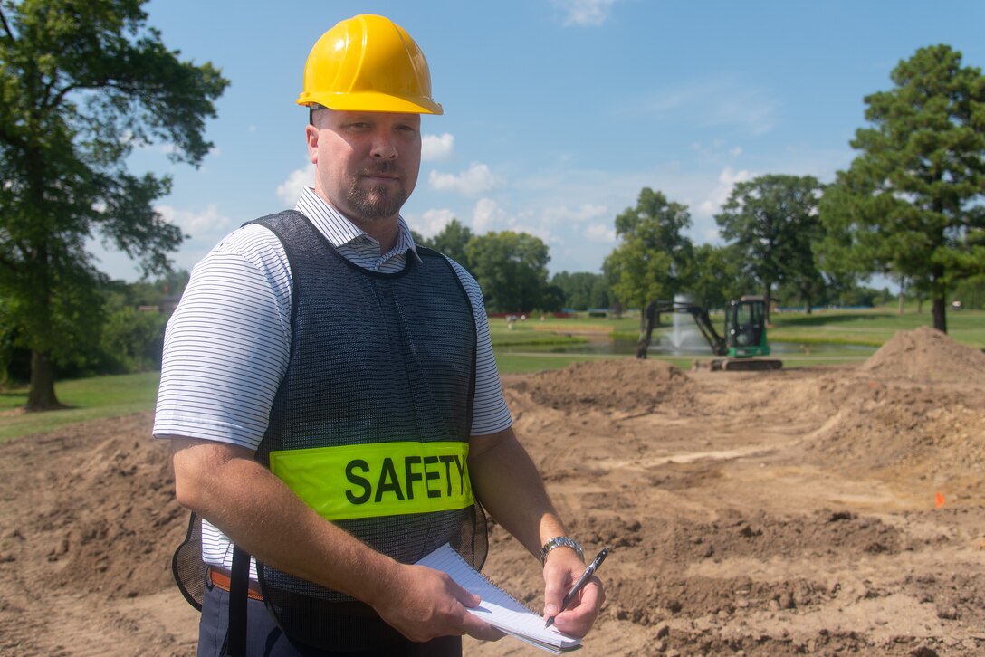 Dustin Hayden, 375th Air Mobility Wing Safety occupational safety and health specialist, surveys an excavation site on Scott Air Force Base, Illinois, August 17, 2021. Observational skill makes this team effective in maintaining the standards necessary to ensure safe conditions for base personnel. (U.S. Air Force photo by Airman 1st Class Stephanie Henry)