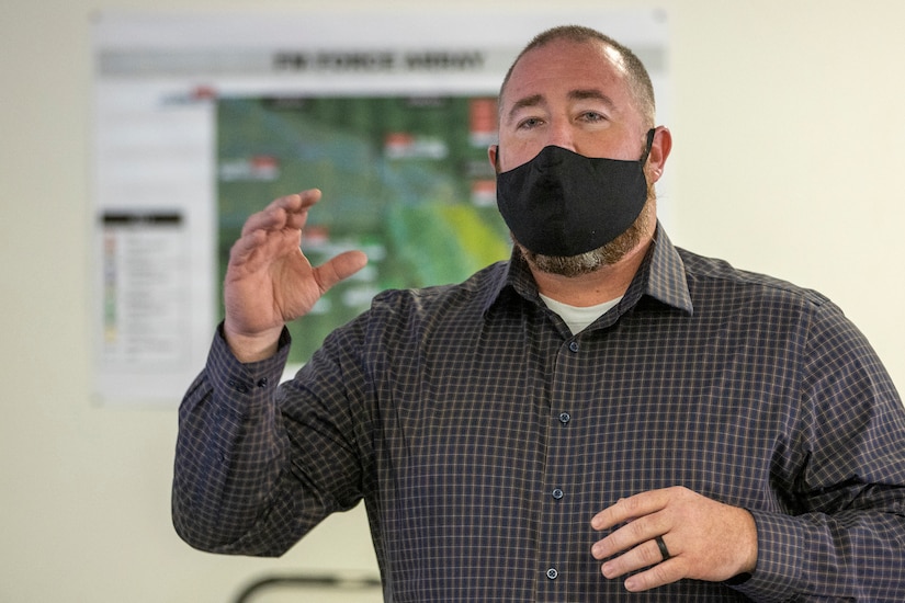 Shawn Crocker, U.S. Army Financial Management Command systems instructor, briefs the Diamond Saber exercise evaluation team at Fort McCoy, Wisconsin, Aug. 14, 2021. Diamond Saber is a U.S. Army Reserve-led exercise that incorporates participation from all components and joint services, and it prepares finance and comptroller Soldiers on the warfighting functions of funding the force, payment support, disbursing operations, accounting, fiscal stewardship, auditability and data analytics. (U.S. Army photo by Mark R. W. Orders-Woempner)