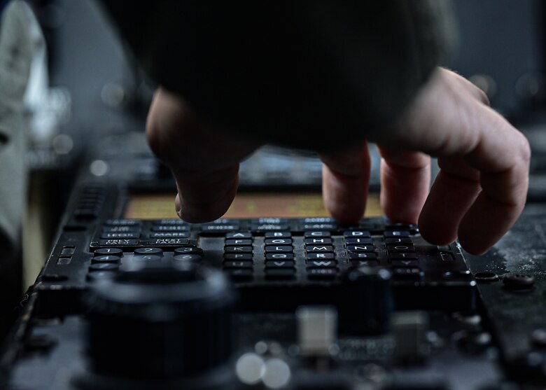 1st Lt. Justin Click, 62d Airlift Squadron student pilot, enters flight data into a C-130J Super Hercules that has undergone the 8.1 block upgrade