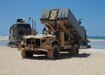 KEKAHA, Hawaii (Aug. 16, 2021) A Navy Marine Expeditionary Ship Interdiction System (NMESIS) launcher deploys into position onboard Pacific Missile Range Facility Barking Sands.