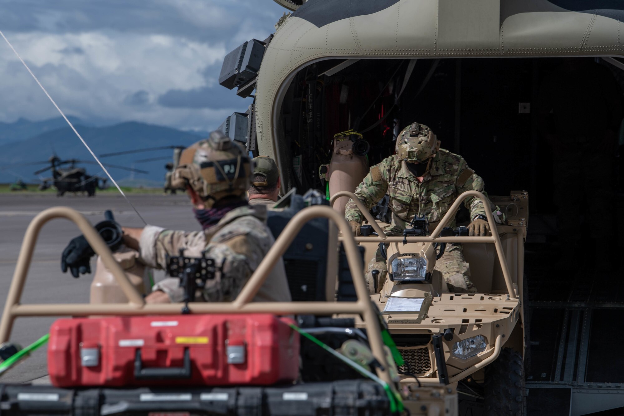 U.S. Air Force Special Tactics operators load tactical vehicles onto a U.S. Army CH-47 Chinook helicopter at Soto Cano Air Base, Honduras, Nov. 23, 2020, while prepping for a landing zone assessment and survey mission.