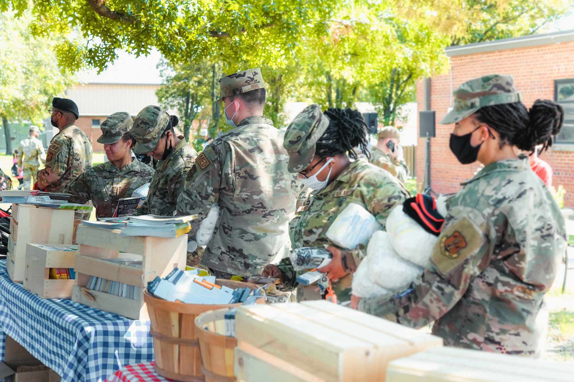 Airmen collect diaper kits, school supplies, and hygiene items at the Community Commons on Joint Base Andrews, Md., Aug. 11, 2021.