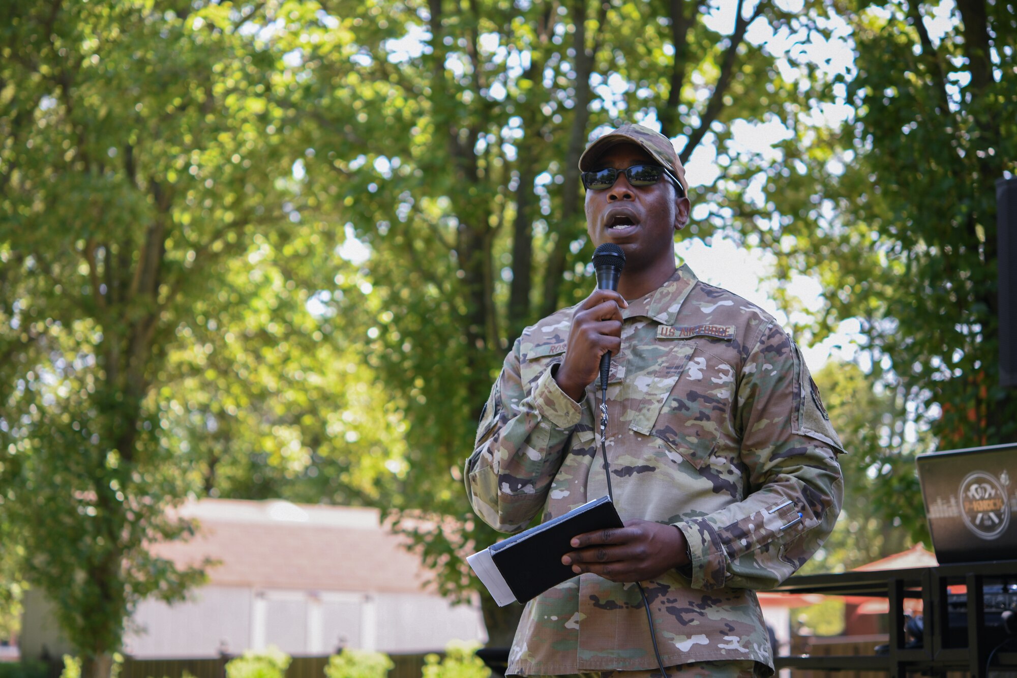 Chief Master Sgt. Ezekiel Ross, 316th Wing command chief, shares a brief message before the start of the Military Market and Enlisted Service Celebration, at the Community Commons on Joint Base Andrews, Md., Aug. 11, 2021.