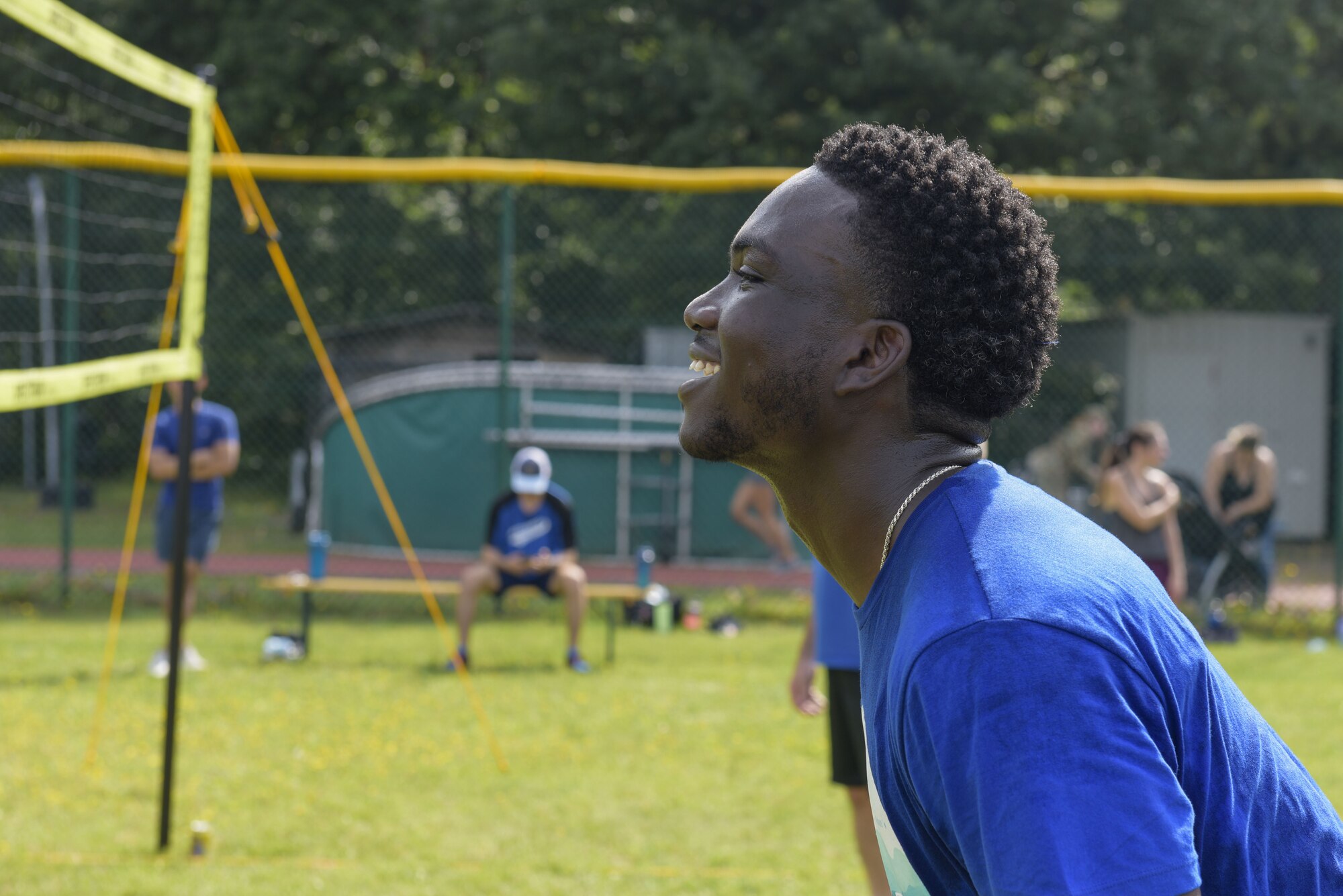 U.S. Air Force Airman 1st Class Elvis Boakye laughs while playing volleyball