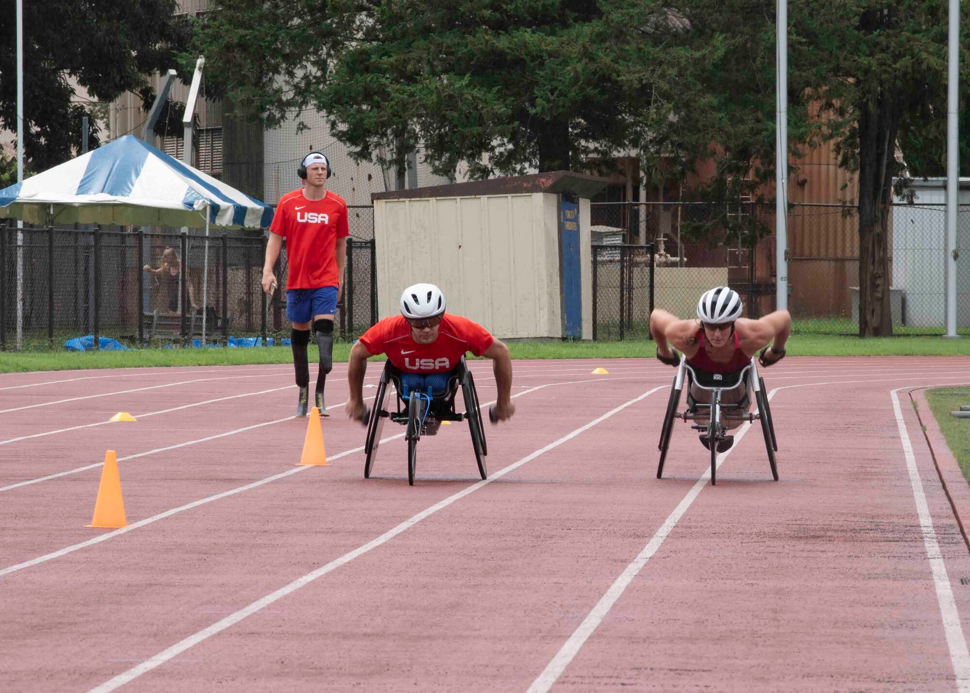 U.S. Para track and field team members practice at Yokota Air Base, Japan, Aug. 18, 2021, before competing in the 2020 Summer Paralympic games in Tokyo.