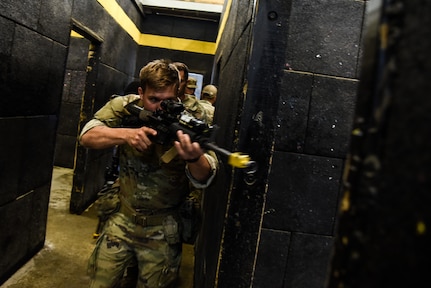 U.S. Army National Guard and Reserve Soldiers practice room clearing July 23, 2021, during an 11B Infantry Transition Course, taught by cadre assigned to the 183rd Regiment, Regional Training Institute at Fort Pickett, Virginia. Over three weeks, the students will learn the skills needed to serve as infantrymen and, if they meet course requirements, will be awarded the 11B Infantry military occupational speciality at the conclusion of the course. (U.S. Army National Guard photo by Sgt. 1st Class Terra C. Gatti)