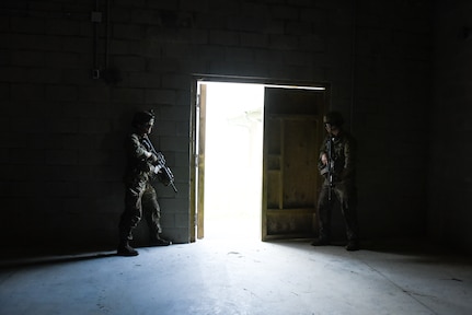 U.S. Army National Guard and Reserve Soldiers conduct urban operations training July 27, 2021, during the 11B Infantry Transition Course, taught by the 183rd Regiment, Regional Training Institute at Fort Pickett, Virginia. This training event served as the culminating event for the 25 Soldiers enrolled in the course, who will earn the 11B Infantryman military occupational speciality after successful completion of three weeks of hands-on infantry training. (U.S. Army National Guard photo by Sgt. 1st Class Terra C. Gatti)