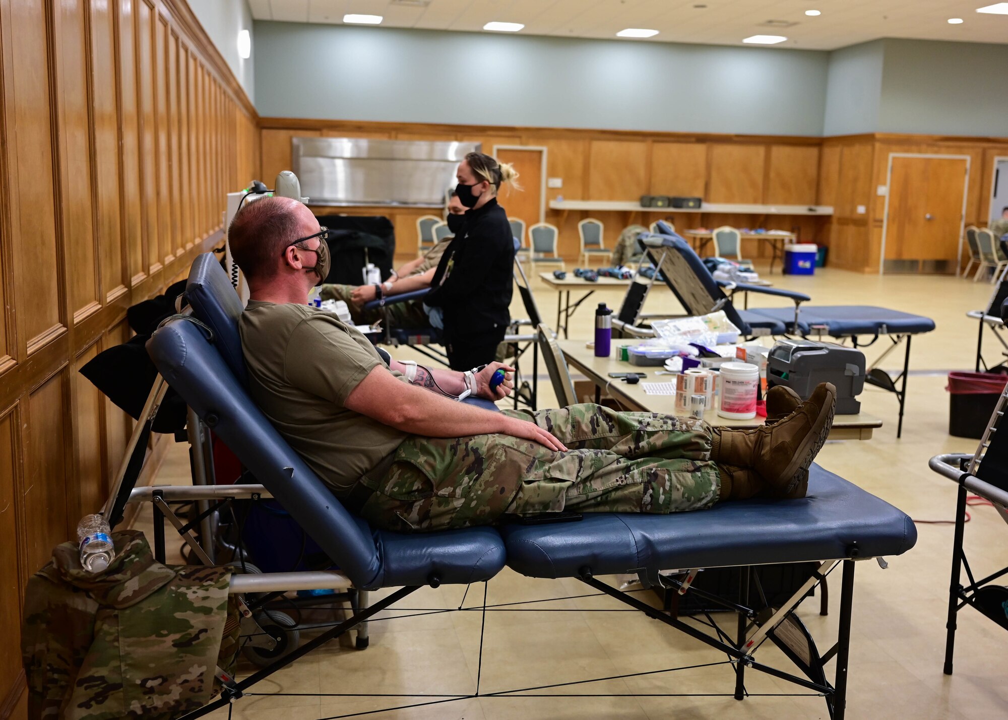 Tech. Sgt. Steven Greenwood, 189th Logistics Readiness Squadron vehicle maintenance journeyman, donates blood during a blood drive