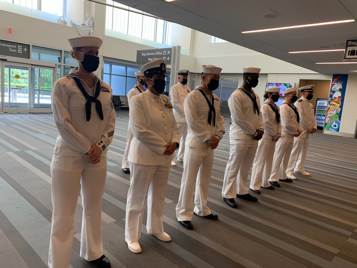 210715-N-ZZ999-001 (July 15, 2021) Raleigh NC. - Navy Operational Support Center Raleigh's funeral honors team prepares to receive the remains of Navy Seaman Second Class Russell Orville Ufford of Kansas City, Missour at the Raleigh-Durham International Airport in Raleigh NC on July 15, 2021. Ufford was killed in action during the attack on Pearl Harbor, December 7, 1941, and he was identified by the POW/MIA accounting agency in February this year. .(US Navy photo by EO2 Katrena Hovatter)