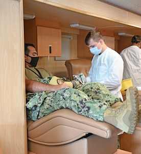 Cryptologic Technician Networks 2nd Class, Christian Perkins donates blood during the Armed Services Blood Program (ASBP) blood drive