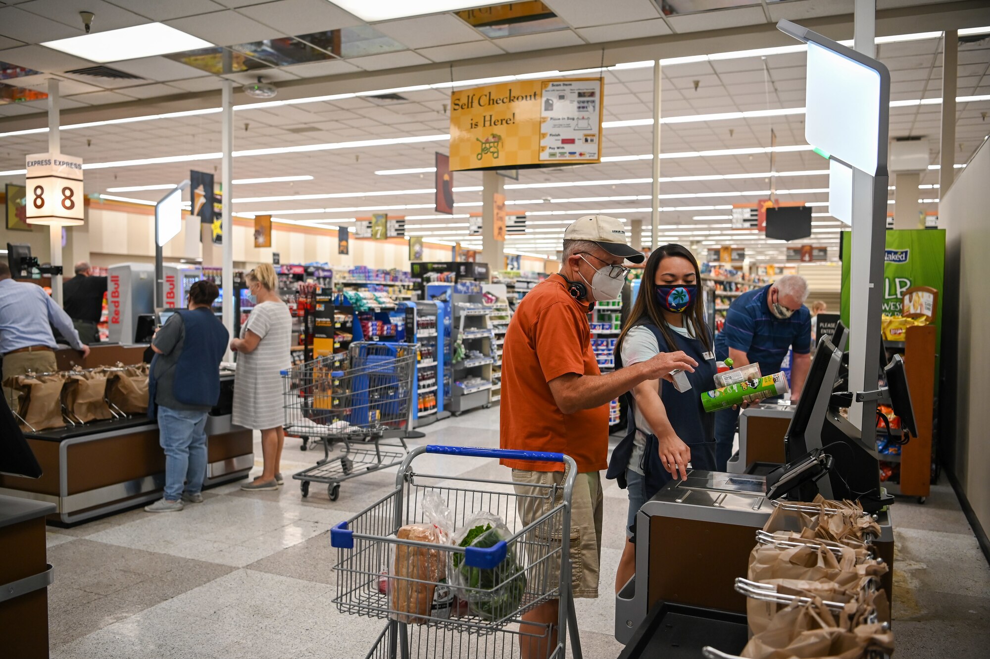 Commissary customers check out at newly installed registers Aug. 18, 2021, at Hill Air Force Base, Utah. Seven regular registers, one express checkout, and four self-checkout stations were installed and give customers a better checkout experience. (U.S. Air Force photo by Cynthia Griggs)