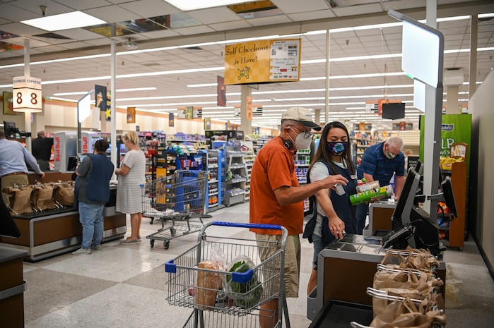 Commissary customers check out at newly installed registers Aug. 18, 2021, at Hill Air Force Base, Utah. Seven regular registers, one express checkout, and four self-checkout stations were installed and give customers a better checkout experience. (U.S. Air Force photo by Cynthia Griggs)