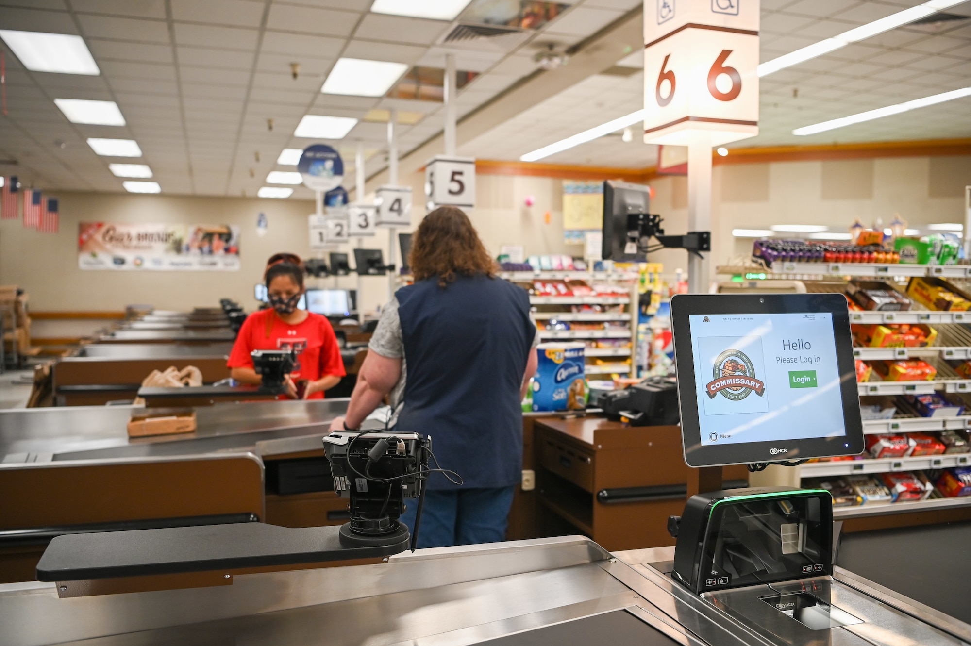 Commissary customers check out at newly installed registers Aug. 18, 2021, at Hill Air Force Base, Utah. Seven regular registers, one express checkout, and four self-checkout stations were installed and give customers a better checkout experience. (U.S. Air Force photo by Cynthia Griggs)