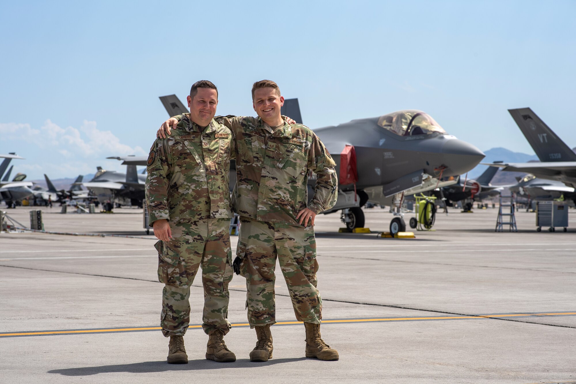 Tech. Sgt. David LaPierre stands with his son, Staff Sgt. Trevor LaPierre for a photo during Red Flag 21-3 at Nellis Air Force Base, Nevada.