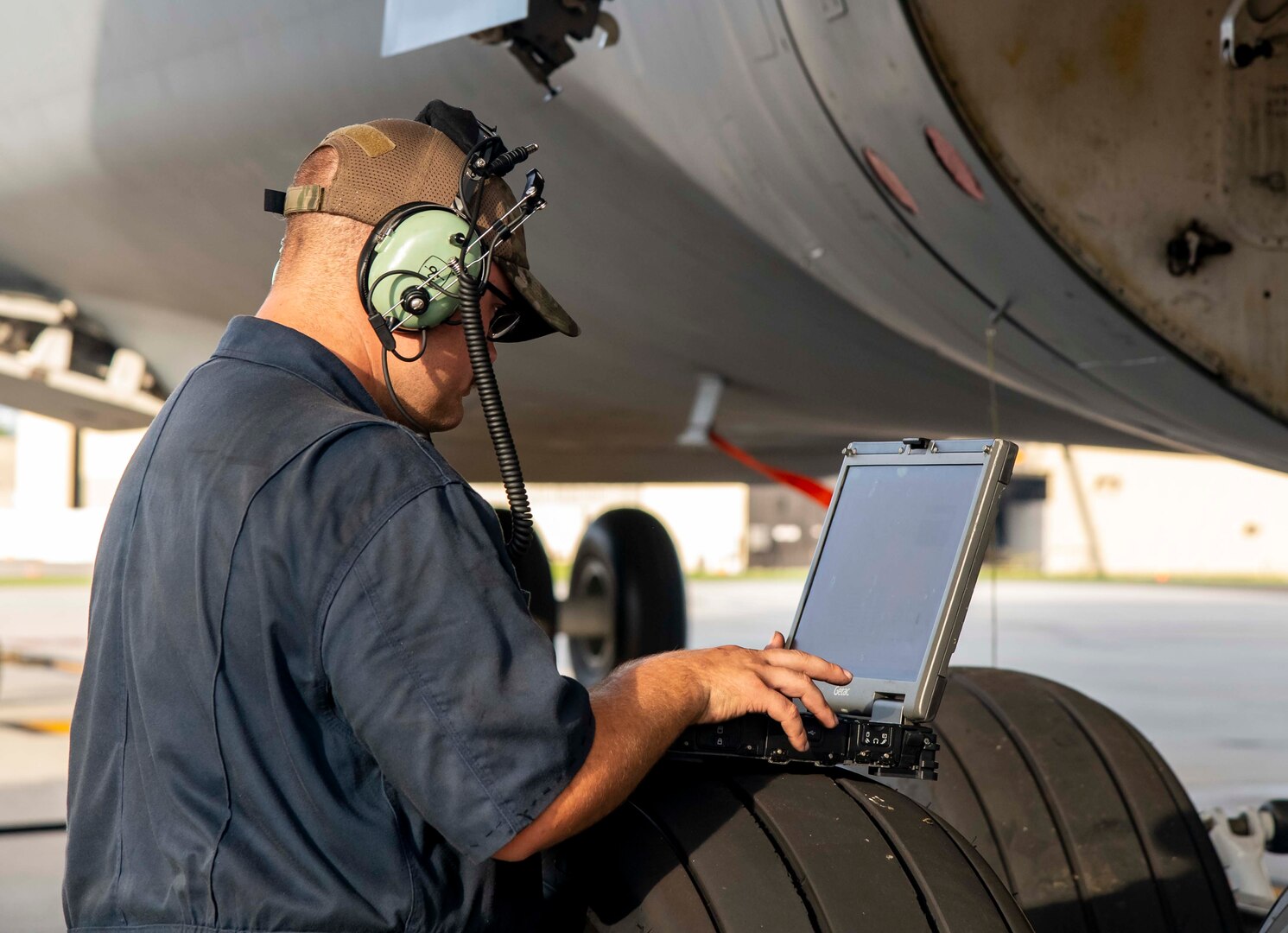 Staff Sgt. Dylan King, 436th Aircraft Maintenance Squadron crew chief, checks technical data on a maintenance laptop while servicing a C-5M Super Galaxy at Dover Air Force Base, Delaware, Aug. 18, 2021. The 436th AMXS Airmen are responsible for the inspection, repair, launch and recovery of Dover AFB’s fleet of C-5M Super Galaxy aircraft. (U.S. Air Force photo by Senior Airman Stephani Barge)