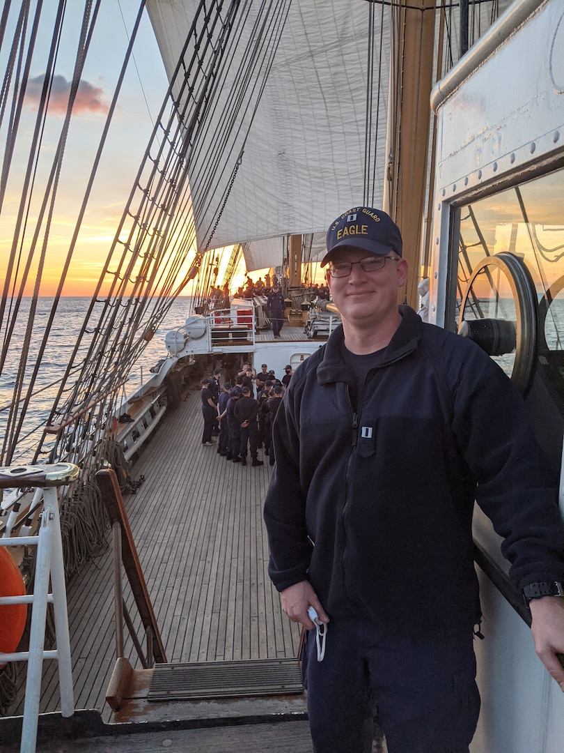 Lt. William Singletary, operations officer aboard the Cutter Eagle, moving pallets summer 2021. U.S. Coast Guard photo.