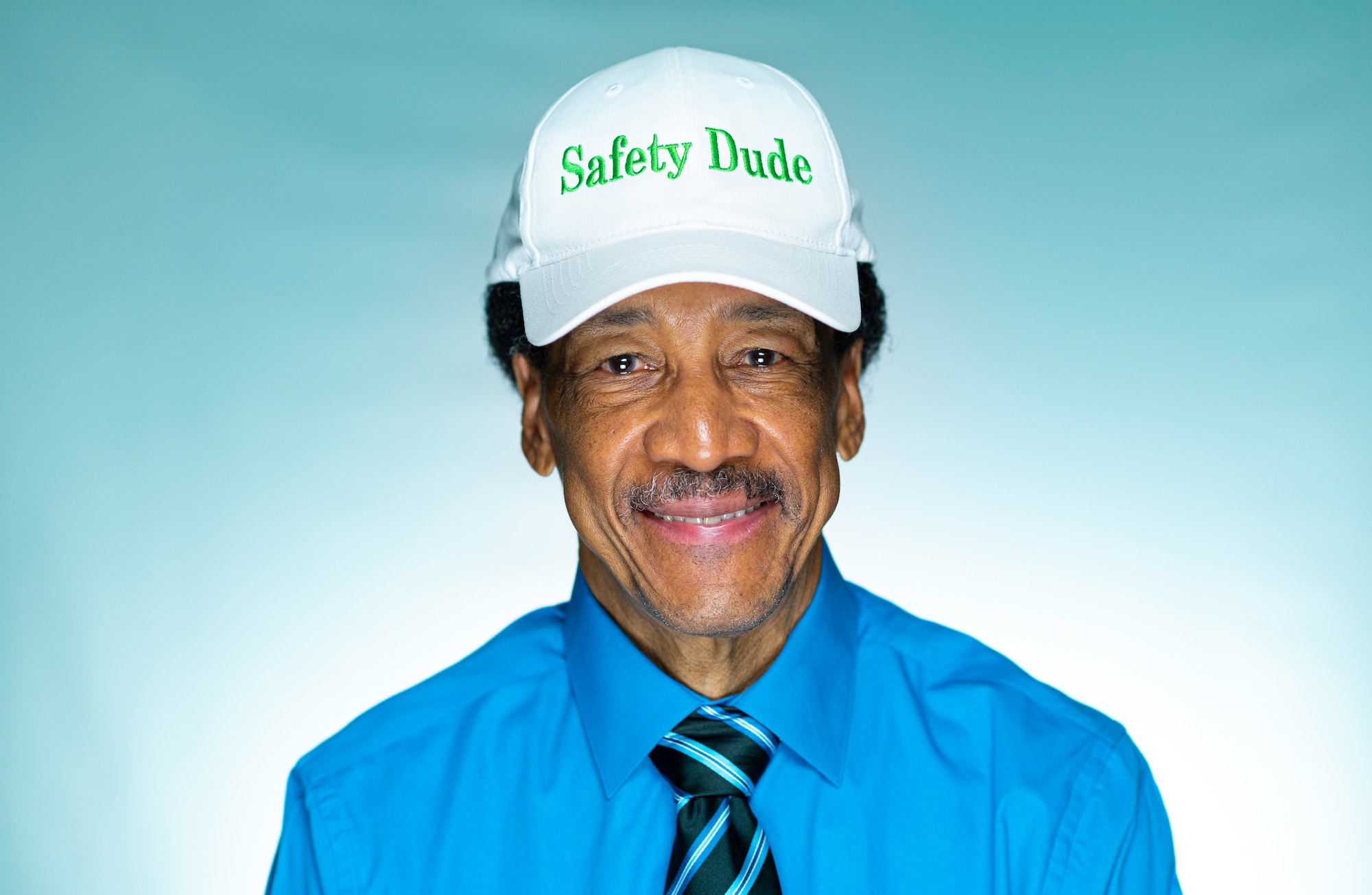 Bernard “Safety Dude” Bruce, U.S. Air Force retired 56th Fighter Wing Occupational Safety and Health manager, wears his ‘Safety Dude’ hat July 30, 2021, at Luke Air Force Base, Arizona. Bruce retired after a combined service of more than 50 years to the Air Force--26 years of active duty and 24 years as a government-service employee. During his time with the Air Force Bruce held many roles including being an Air Traffic Controller in the Vietnam War, a radio host for Air Force’s Radio and Television Network, the 56th Fighter Wing Occupational Safety and Health manager and the historian for the local Tuskegee Airmen Incorporated chapter. (U.S. Air Force photo by Senior Airman Leala Marquez)