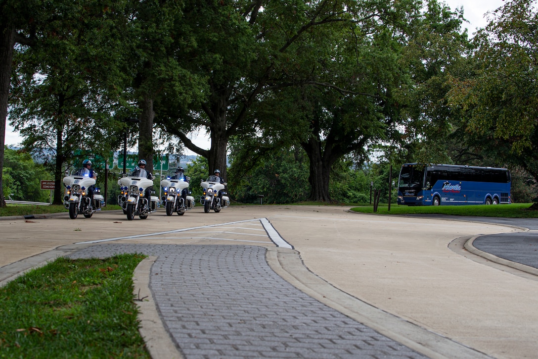 Veterans arrive prior to an Honor Flight performance by the Silent Drill Platoon at the Marine Corps War Memorial, Arlington, Va., Aug. 18, 2021. The Honor Flight Network is a national network whose mission is to transport America’s veterans to Washington, D.C. to visit memorials dedicated to honoring those who have served and sacrificed for our country. (U.S. Marine Corps photo by Lance Cpl. Tanner D. Lambert)