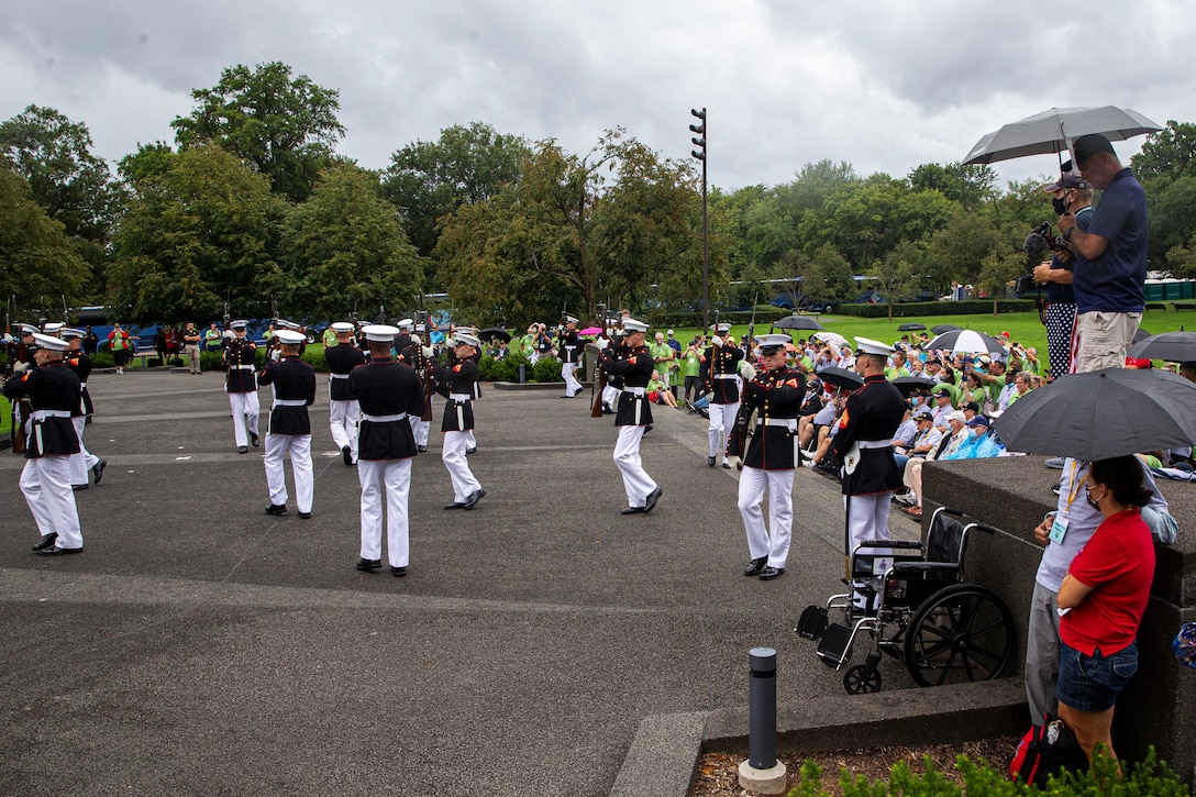 Marines with the Silent Drill Platoon execute their “chaos” sequence during an Honor Flight performance at the Marine Corps War Memorial, Arlington, Va., Aug. 18, 2021. The Honor Flight Network is a national network whose mission is to transport America’s veterans to Washington, D.C. to visit memorials dedicated to honoring those who have served and sacrificed for our country. (U.S. Marine Corps photo by Lance Cpl. Tanner D. Lambert)