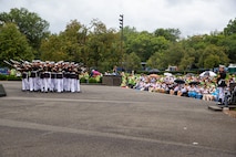 Marines with the Silent Drill Platoon execute their “bursting bomb” sequence during an Honor Flight performance at the Marine Corps War Memorial, Arlington, Va., Aug. 18, 2021.
