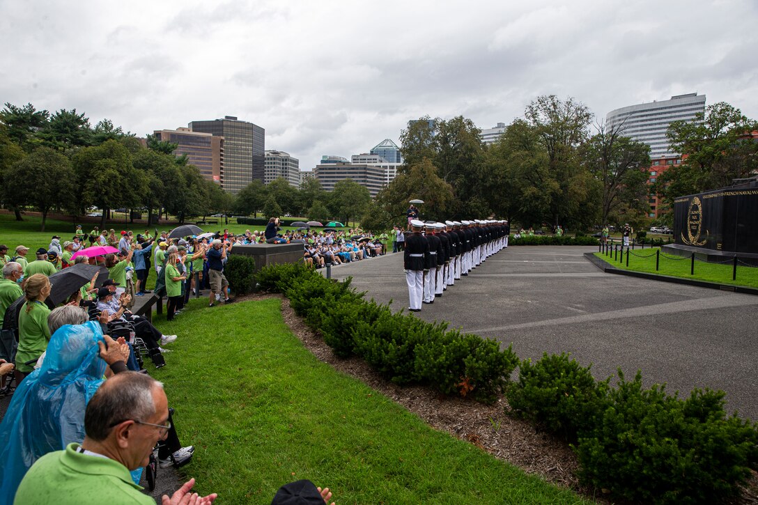 Marines with the Silent Drill Platoon execute their “long line” sequence during an Honor Flight performance at the Marine Corps War Memorial, Arlington, Va., Aug. 18, 2021. The Honor Flight Network is a national network whose mission is to transport America’s veterans to Washington, D.C. to visit memorials dedicated to honoring those who have served and sacrificed for our country. (U.S. Marine Corps photo by Lance Cpl. Tanner D. Lambert)