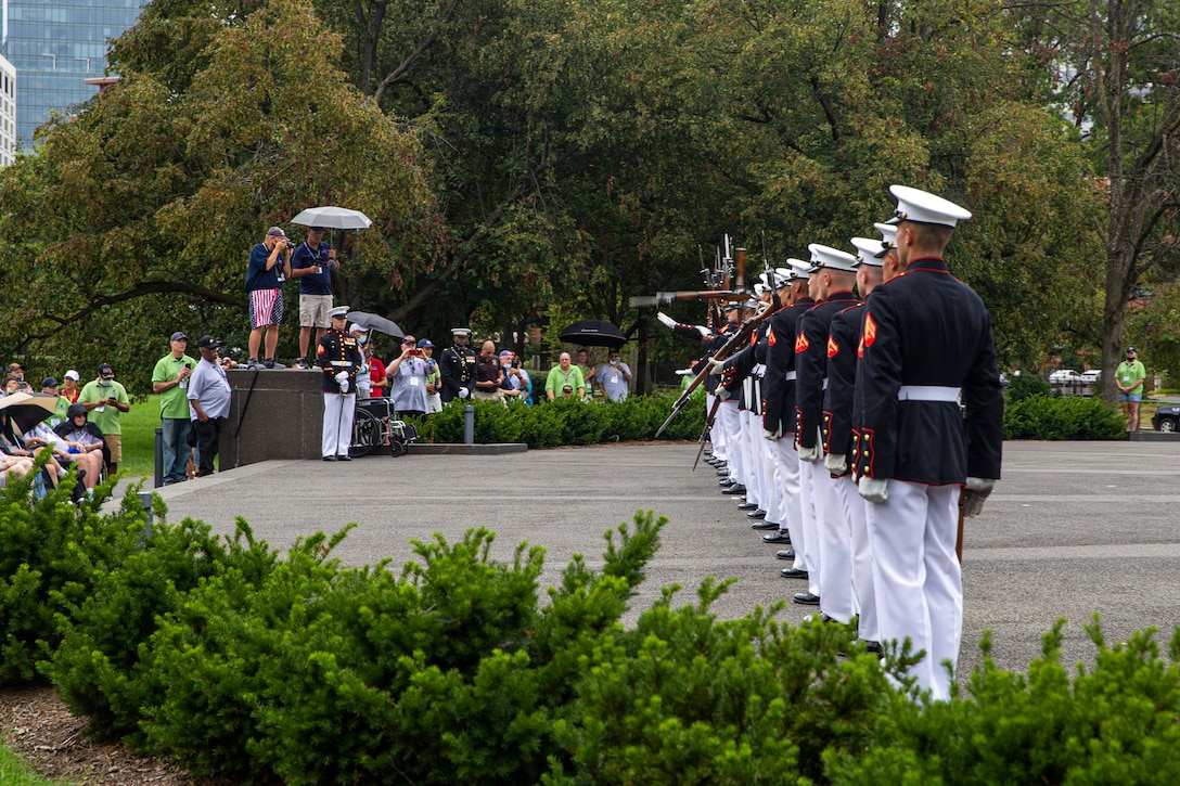 Marines with the Silent Drill Platoon execute their “long line” sequence during an Honor Flight performance at the Marine Corps War Memorial, Arlington, Va., Aug. 18, 2021. The Honor Flight Network is a national network whose mission is to transport America’s veterans to Washington, D.C. to visit memorials dedicated to honoring those who have served and sacrificed for our country. (U.S. Marine Corps photo by Lance Cpl. Tanner D. Lambert)