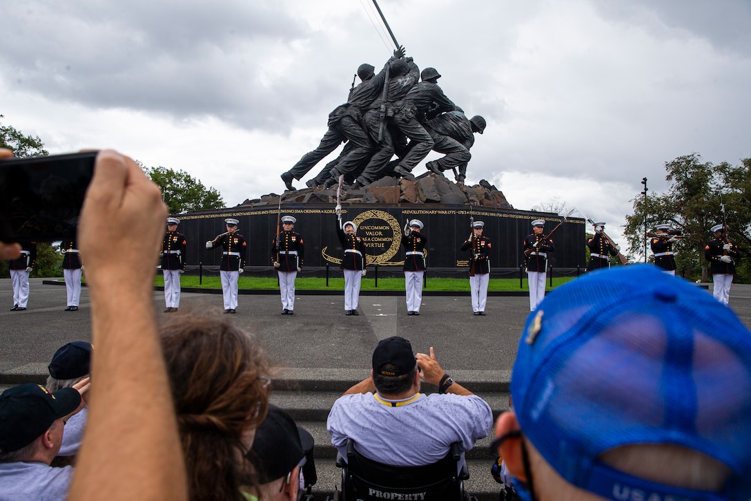 Marines with the Silent Drill Platoon execute their “long line” sequence during an Honor Flight performance at the Marine Corps War Memorial, Arlington, Va., Aug. 18, 2021. The Honor Flight Network is a national network whose mission is to transport America’s veterans to Washington, D.C. to visit memorials dedicated to honoring those who have served and sacrificed for our country. (U.S. Marine Corps photo by Lance Cpl. Tanner D. Lambert)