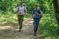 American and Romanian reserve service members participate in an orienteering training event