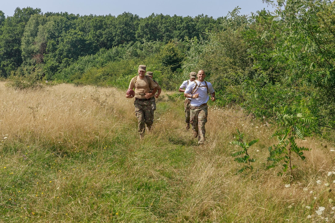 American and Romanian reserve service members participate in an orienteering training event