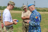 American and Romanian reserve service members participate in an orienteering training event