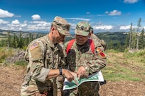 American and Romanian reserve service members participate in an orienteering training event